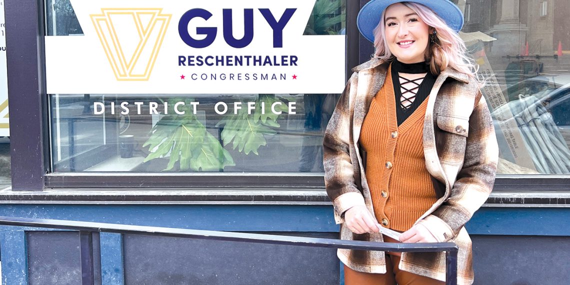 A woman stands outside Congressman Guy Reschenthaler’s district office in Pittsburgh.