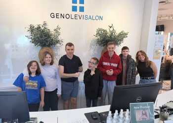 STARS Prom students pose together inside Geno Levi Salon after preparing for their special prom event.