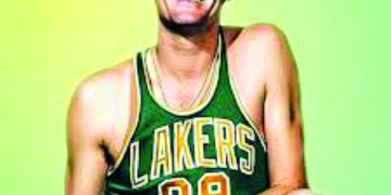 A basketball player in a Lakers jersey poses with a basketball in a vintage style portrait.