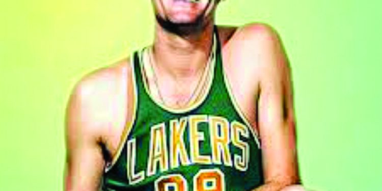 A basketball player in a Lakers jersey poses with a basketball in a vintage style portrait.