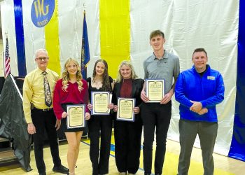Student scholarship recipients and presenters pose with Lions Club scholarship certificates during an awards ceremony at West Greene High School.