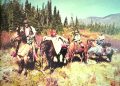 A group of hunters on horseback gathers in a mountain meadow with pack horses carrying harvested game during a backcountry hunt.