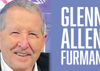 A close-up headshot shows an older man with short gray hair smiling at the camera while wearing a dark jacket over a white collared shirt. On the right side of the graphic, large white text on a blue background reads "GLENN ALLEN FURMAN.
