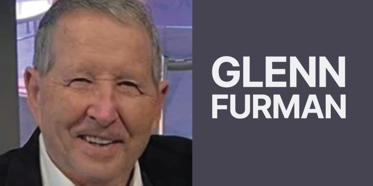 Close-up headshot of an older man smiling beside large white text that reads "GLENN FURMAN" on a grey background.