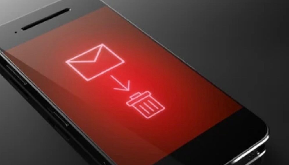 Angled smartphone with a glowing red screen showing an envelope icon, downward arrow, and trash bin symbol.