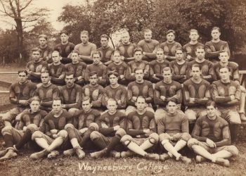 Sepia 1925 group photograph of the Waynesburg College football squad posed outdoors.