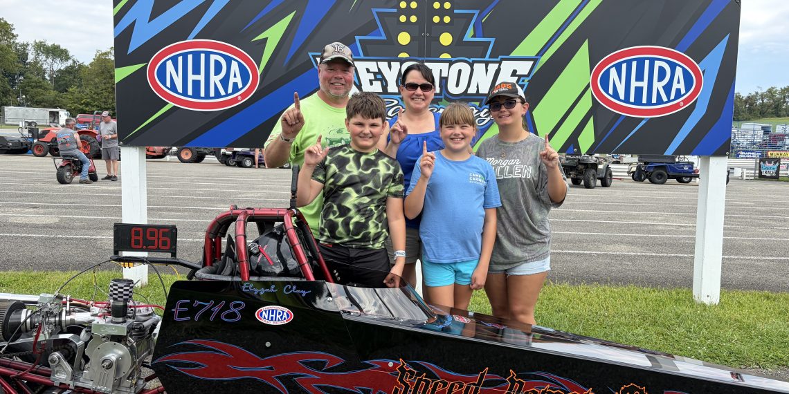 Elyjah Clay and family pose with his Speed Demon junior dragster at Keystone Motorsports Park.