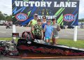 Elyjah Clay and family pose with his Speed Demon junior dragster at Keystone Motorsports Park.