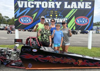 Elyjah Clay and family pose with his Speed Demon junior dragster at Keystone Motorsports Park.