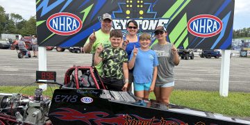 Elyjah Clay and family pose with his Speed Demon junior dragster at Keystone Motorsports Park.