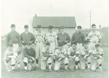 Vintage black-and-white team photograph of baseball players in C.T.H.S. uniforms posing in two rows on a grassy field.