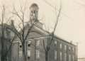 Historic circa-1930 photograph of Hanna Hall at Waynesburg College, a three-story brick building with a domed cupola surrounded by leafless trees.