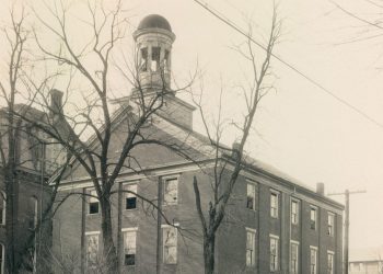 Historic circa-1930 photograph of Hanna Hall at Waynesburg College, a three-story brick building with a domed cupola surrounded by leafless trees.