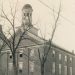 Historic circa-1930 photograph of Hanna Hall at Waynesburg College, a three-story brick building with a domed cupola surrounded by leafless trees.