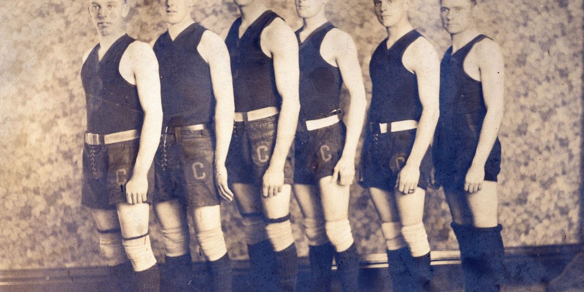 Six Cumberland Township High School basketball players pose in vintage uniforms and high-top athletic shoes for an early 20th-century team photograph.