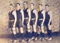 Six Cumberland Township High School basketball players pose in vintage uniforms and high-top athletic shoes for an early 20th-century team photograph.