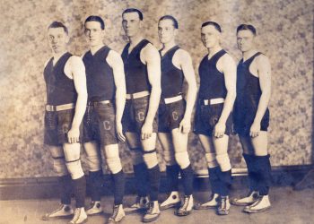 Six Cumberland Township High School basketball players pose in vintage uniforms and high-top athletic shoes for an early 20th-century team photograph.
