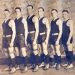 Six Cumberland Township High School basketball players pose in vintage uniforms and high-top athletic shoes for an early 20th-century team photograph.